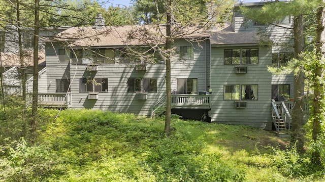 67 Woodside Cir Unit 67, Torrington, CT 06790 - rear view of house featuring a chimney, roof with shingles, and a wall mounted AC
