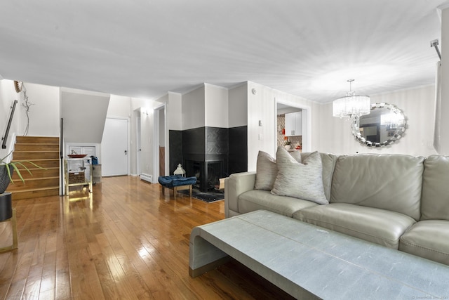 67 Woodside Cir Unit 67, Torrington, CT 06790 - living room featuring hardwood / wood-style floors, stairway, and a chandelier