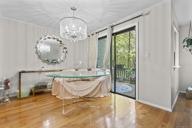 67 Woodside Cir Unit 67, Torrington, CT 06790 - dining space with wood-type flooring, a chandelier, and ornamental molding