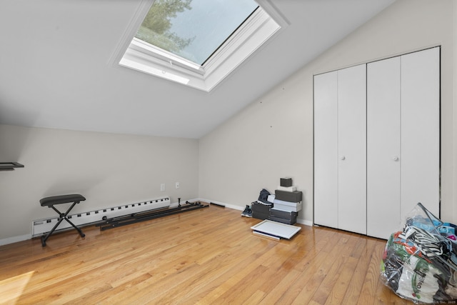 67 Woodside Cir Unit 67, Torrington, CT 06790 - additional living space with a baseboard heating unit, vaulted ceiling, a skylight, and hardwood / wood-style floors