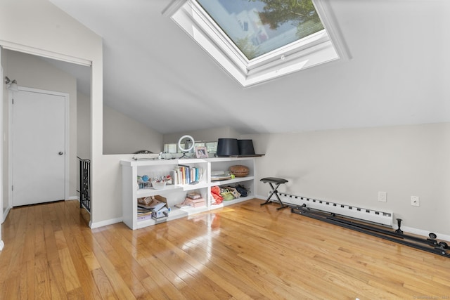 67 Woodside Cir Unit 67, Torrington, CT 06790 - bonus room with a skylight, vaulted ceiling, a baseboard radiator, and hardwood / wood-style flooring