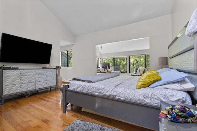 67 Woodside Cir Unit 67, Torrington, CT 06790 - bedroom featuring wood finished floors, high vaulted ceiling, and a baseboard heating unit
