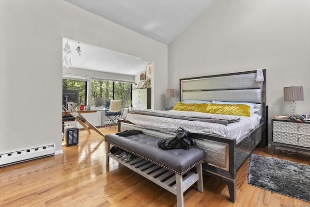 67 Woodside Cir Unit 67, Torrington, CT 06790 - bedroom featuring a baseboard radiator, wood finished floors, and high vaulted ceiling