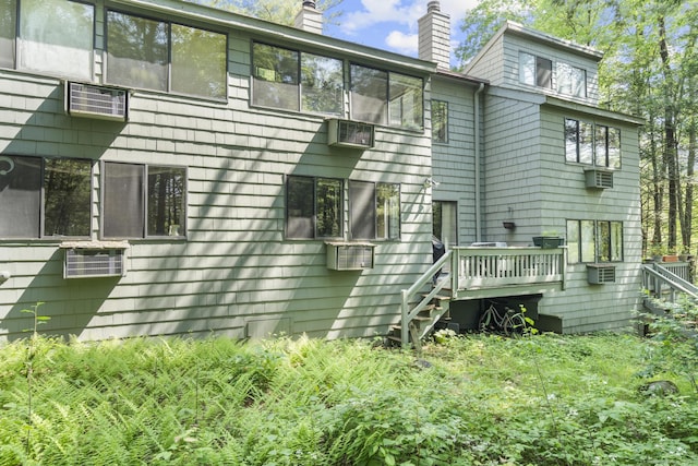 67 Woodside Cir Unit 67, Torrington, CT 06790 - view of home's exterior with a chimney