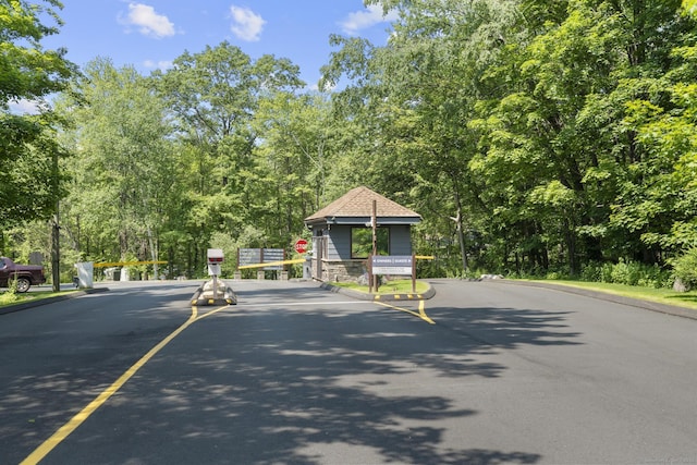 67 Woodside Cir Unit 67, Torrington, CT 06790 - view of asphalt road featuring traffic signs