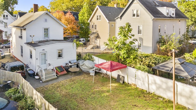 77 3rd St, New Haven, CT 06519 - back of property featuring entry steps and a fenced backyard