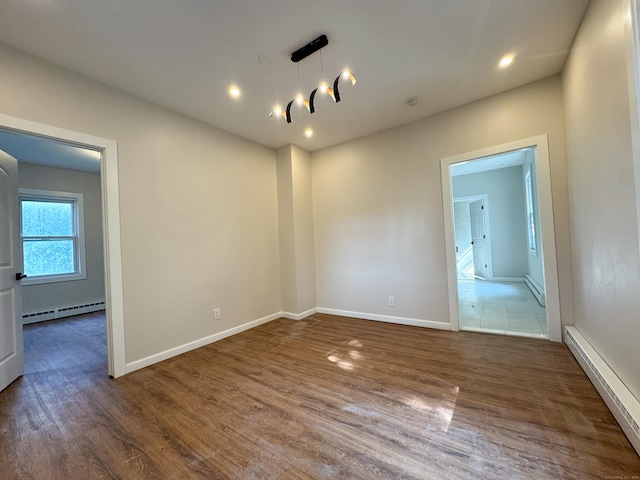 21 Garibaldi St, Watertown, CT 06779 - spare room with a baseboard radiator, dark wood-type flooring, and recessed lighting