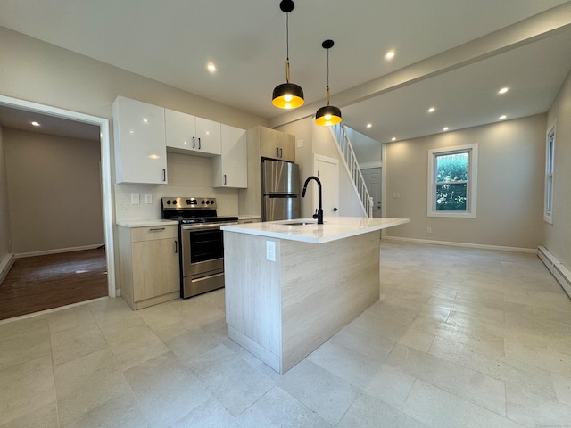 21 Garibaldi St, Watertown, CT 06779 - kitchen with stainless steel appliances, modern cabinets, light countertops, an island with sink, and white cabinets