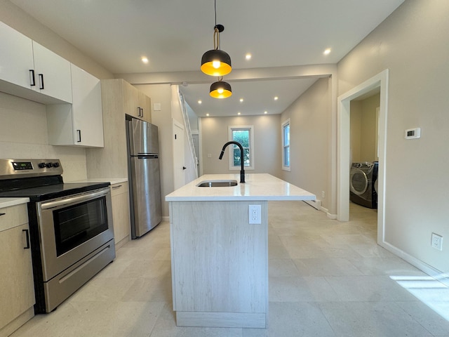 21 Garibaldi St, Watertown, CT 06779 - kitchen featuring appliances with stainless steel finishes, a kitchen island with sink, hanging light fixtures, modern cabinets, and washer and dryer