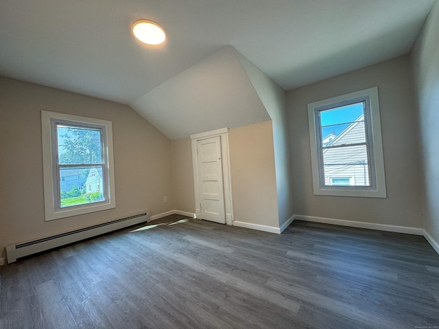 21 Garibaldi St, Watertown, CT 06779 - additional living space featuring a baseboard radiator, dark wood-style floors, and vaulted ceiling