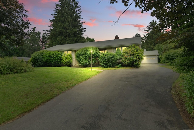 206 Center Rd, Vernon, CT 06066 - view of front facade with driveway, a chimney, and a front yard