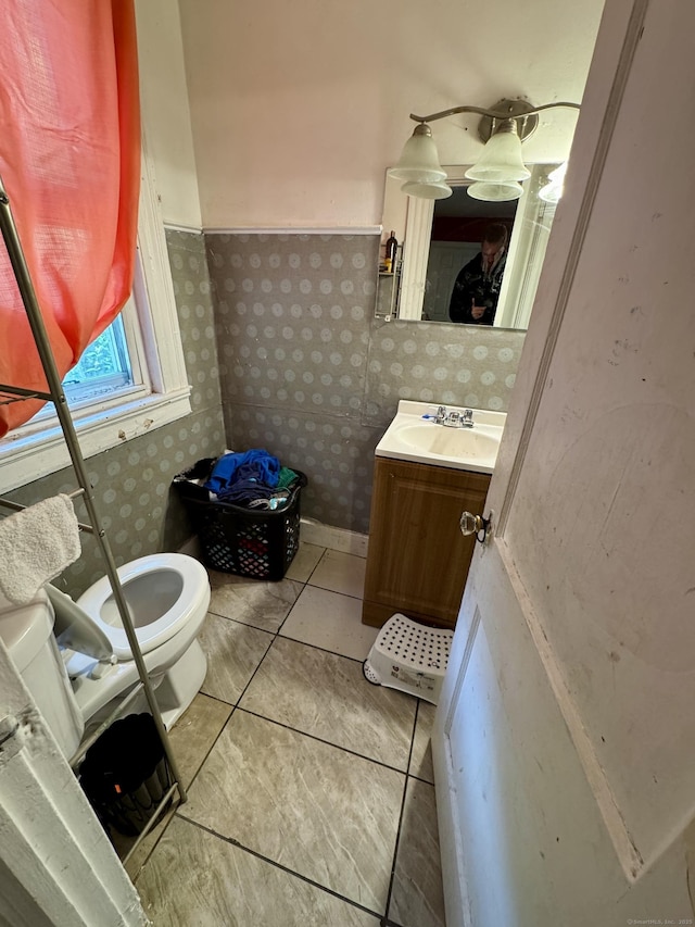 81 Easton Ave, Waterbury, CT 06704 - half bath featuring vanity, tile patterned floors, and wallpapered walls