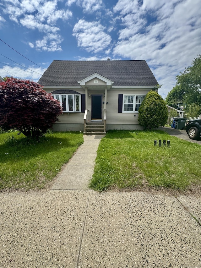 111 Hollywood Ave, Bridgeport, CT 06606 - bungalow-style house featuring a front lawn and a shingled roof