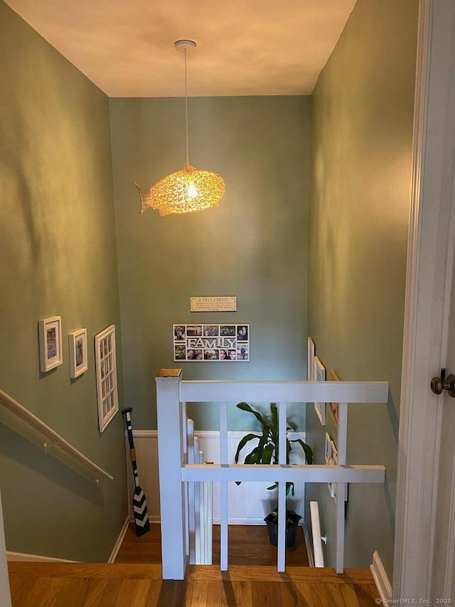 175 W Walk Unit 175, West Haven, CT 06516 - staircase featuring wood finished floors and a chandelier