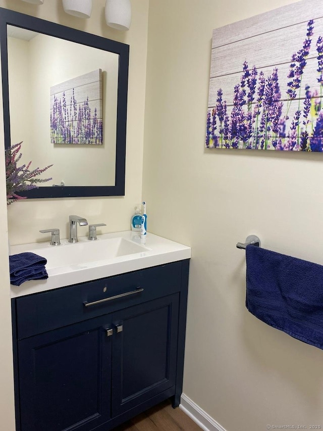 175 W Walk Unit 175, West Haven, CT 06516 - bathroom featuring vanity and wood finished floors