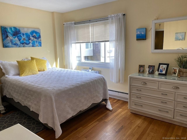 175 W Walk Unit 175, West Haven, CT 06516 - bedroom with a baseboard radiator and wood finished floors
