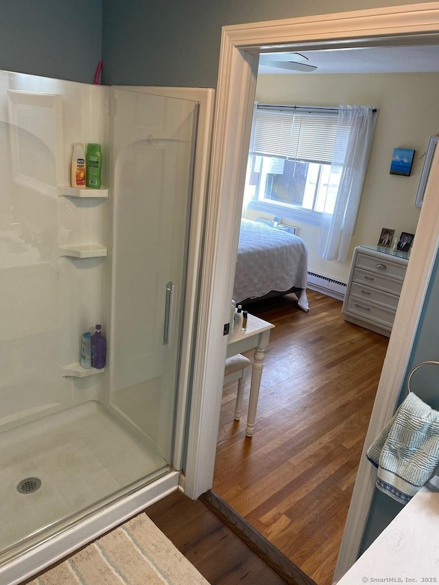 175 W Walk Unit 175, West Haven, CT 06516 - full bath with baseboard heating, wood finished floors, a shower stall, and ensuite bath