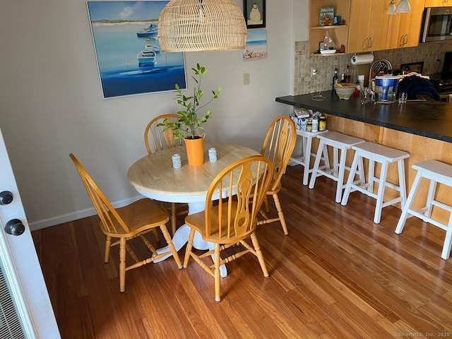175 W Walk Unit 175, West Haven, CT 06516 - dining space with wood finished floors and baseboards