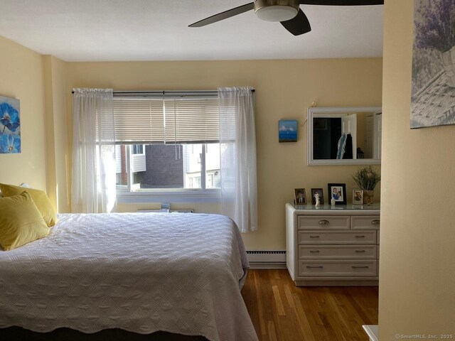 175 W Walk Unit 175, West Haven, CT 06516 - bedroom with a baseboard heating unit, wood finished floors, and a ceiling fan