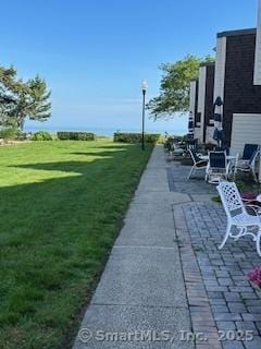 175 W Walk Unit 175, West Haven, CT 06516 - view of grassy yard with a patio area