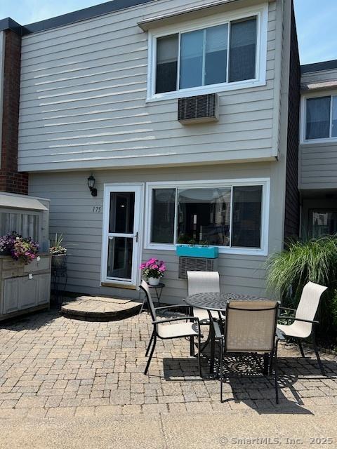 175 W Walk Unit 175, West Haven, CT 06516 - rear view of house with a patio and outdoor dining area