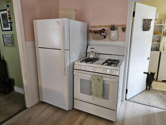 346 Pine St, Bristol, CT 06010 - kitchen featuring white appliances and wood finished floors