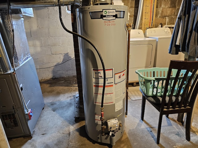 346 Pine St, Bristol, CT 06010 - utility room with water heater, washing machine and dryer, and heating unit