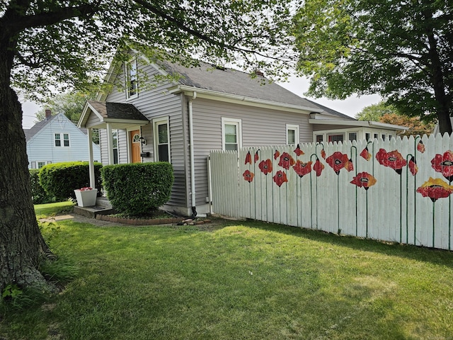346 Pine St, Bristol, CT 06010 - view of side of property with a yard and a shingled roof