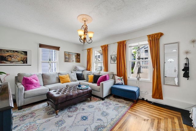 385 Blatchley Ave, New Haven, CT 06513 - living room featuring plenty of natural light, a chandelier, and a textured ceiling