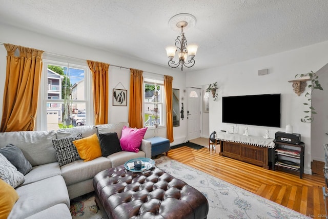 385 Blatchley Ave, New Haven, CT 06513 - living area featuring a chandelier, healthy amount of natural light, a textured ceiling, and wood finished floors
