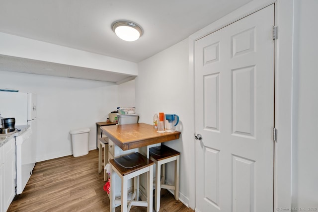 385 Blatchley Ave, New Haven, CT 06513 - kitchen with wood finished floors, white cabinetry, and light countertops