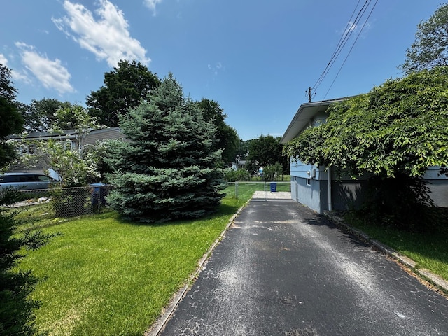 26 Oakleaf Dr, Waterbury, CT 06708 - view of asphalt driveway featuring curbs