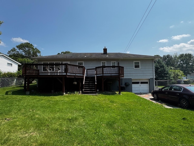 26 Oakleaf Dr, Waterbury, CT 06708 - rear view of house with stairs, a deck, a garage, concrete driveway, and a chimney