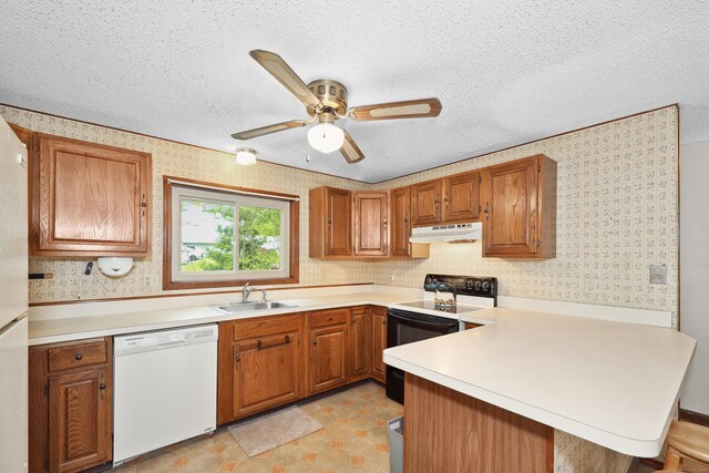 24 Cadbury Pl, Naugatuck, CT 06770 - kitchen featuring white dishwasher, electric range, under cabinet range hood, a peninsula, and wallpapered walls