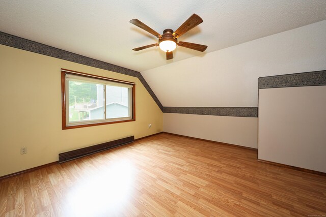 24 Cadbury Pl, Naugatuck, CT 06770 - additional living space with light wood-style floors, ceiling fan, lofted ceiling, and a baseboard heating unit