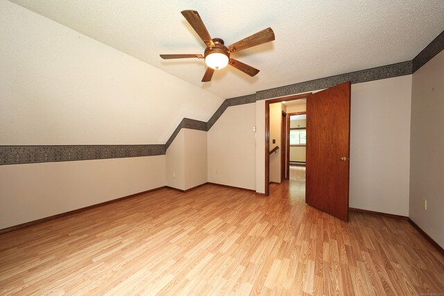 24 Cadbury Pl, Naugatuck, CT 06770 - additional living space with light wood-style flooring, a ceiling fan, lofted ceiling, and a textured ceiling