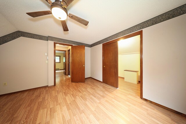 24 Cadbury Pl, Naugatuck, CT 06770 - spare room with light wood finished floors, a ceiling fan, and a textured ceiling