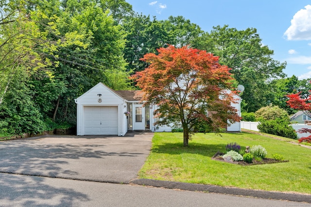 98 Morningside Dr W, Bristol, CT 06010 - view of front facade featuring an attached garage, asphalt driveway, and a front lawn