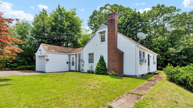 98 Morningside Dr W, Bristol, CT 06010 - view of front of house with a chimney, a front lawn, concrete driveway, and a garage