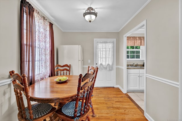 98 Morningside Dr W, Bristol, CT 06010 - dining space with light wood-style floors and ornamental molding