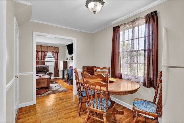 98 Morningside Dr W, Bristol, CT 06010 - dining space featuring light wood-style flooring and crown molding