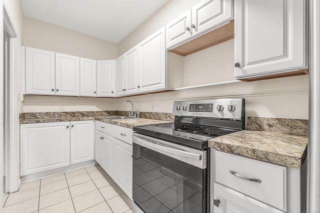 80 Cartright St Unit Gc, Bridgeport, CT 06604 - kitchen featuring stainless steel electric range, white cabinetry, and light tile patterned floors