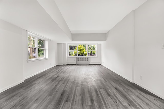 80 Cartright St Unit Gc, Bridgeport, CT 06604 - empty room with radiator, dark wood finished floors, and healthy amount of natural light