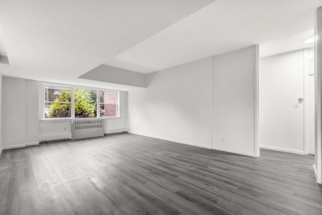 80 Cartright St Unit Gc, Bridgeport, CT 06604 - unfurnished living room featuring a baseboard radiator, radiator heating unit, and wood finished floors