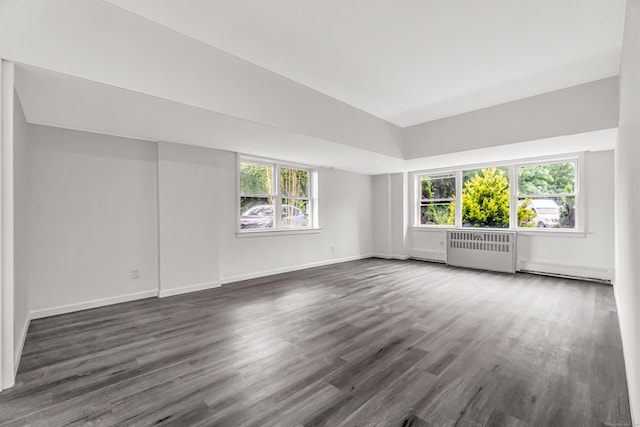 80 Cartright St Unit Gc, Bridgeport, CT 06604 - unfurnished room featuring radiator heating unit, dark wood finished floors, a baseboard heating unit, and vaulted ceiling