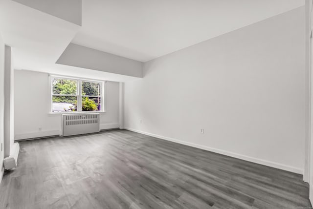 80 Cartright St Unit Gc, Bridgeport, CT 06604 - unfurnished room featuring radiator and wood finished floors