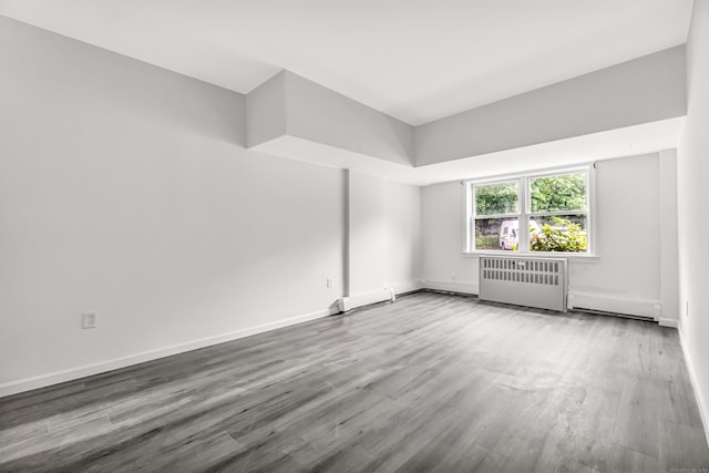 80 Cartright St Unit Gc, Bridgeport, CT 06604 - spare room featuring wood finished floors and radiator heating unit