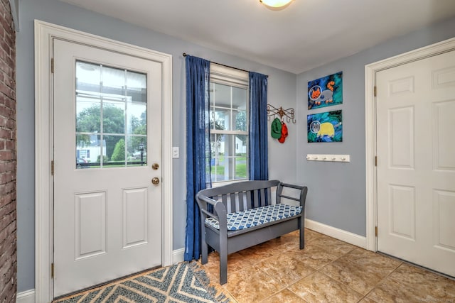 31 Meadowview Dr, Trumbull, CT 06611 - foyer with light tile patterned floors and brick wall
