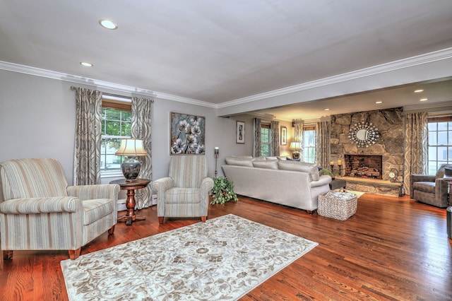 31 Meadowview Dr, Trumbull, CT 06611 - living area with healthy amount of natural light, ornamental molding, wood finished floors, a stone fireplace, and recessed lighting
