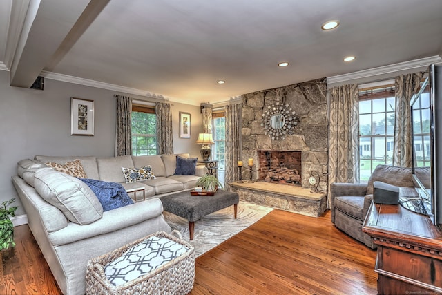 31 Meadowview Dr, Trumbull, CT 06611 - living area with ornamental molding, wood finished floors, recessed lighting, and a stone fireplace